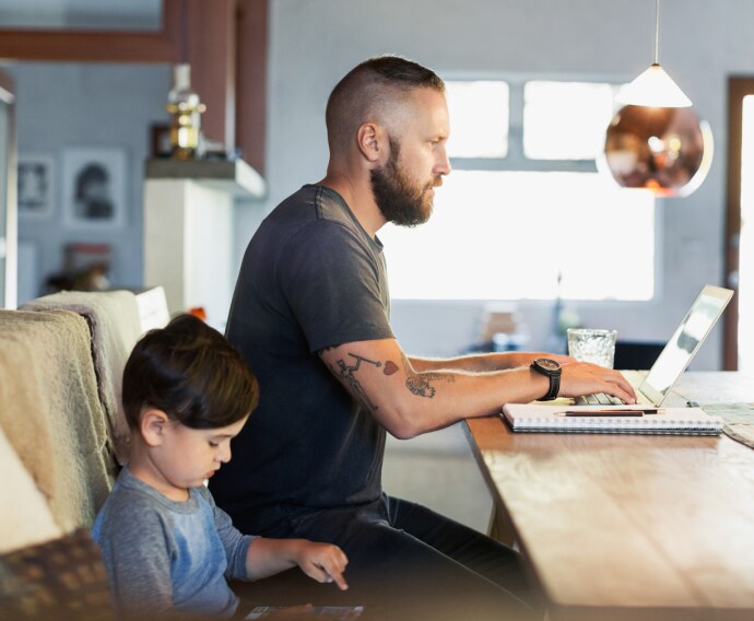 Father and son using technologies.